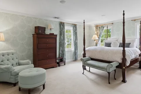 a bedroom with furniture and a window