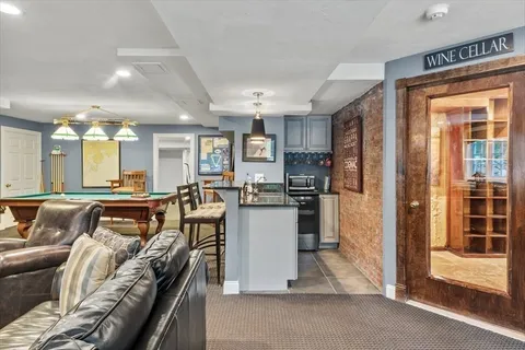 a kitchen with a refrigerator and a stove top oven