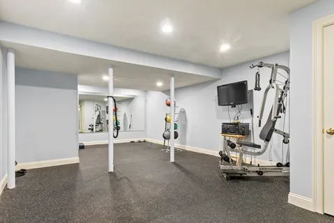 a front view of a house with a yard table and chairs