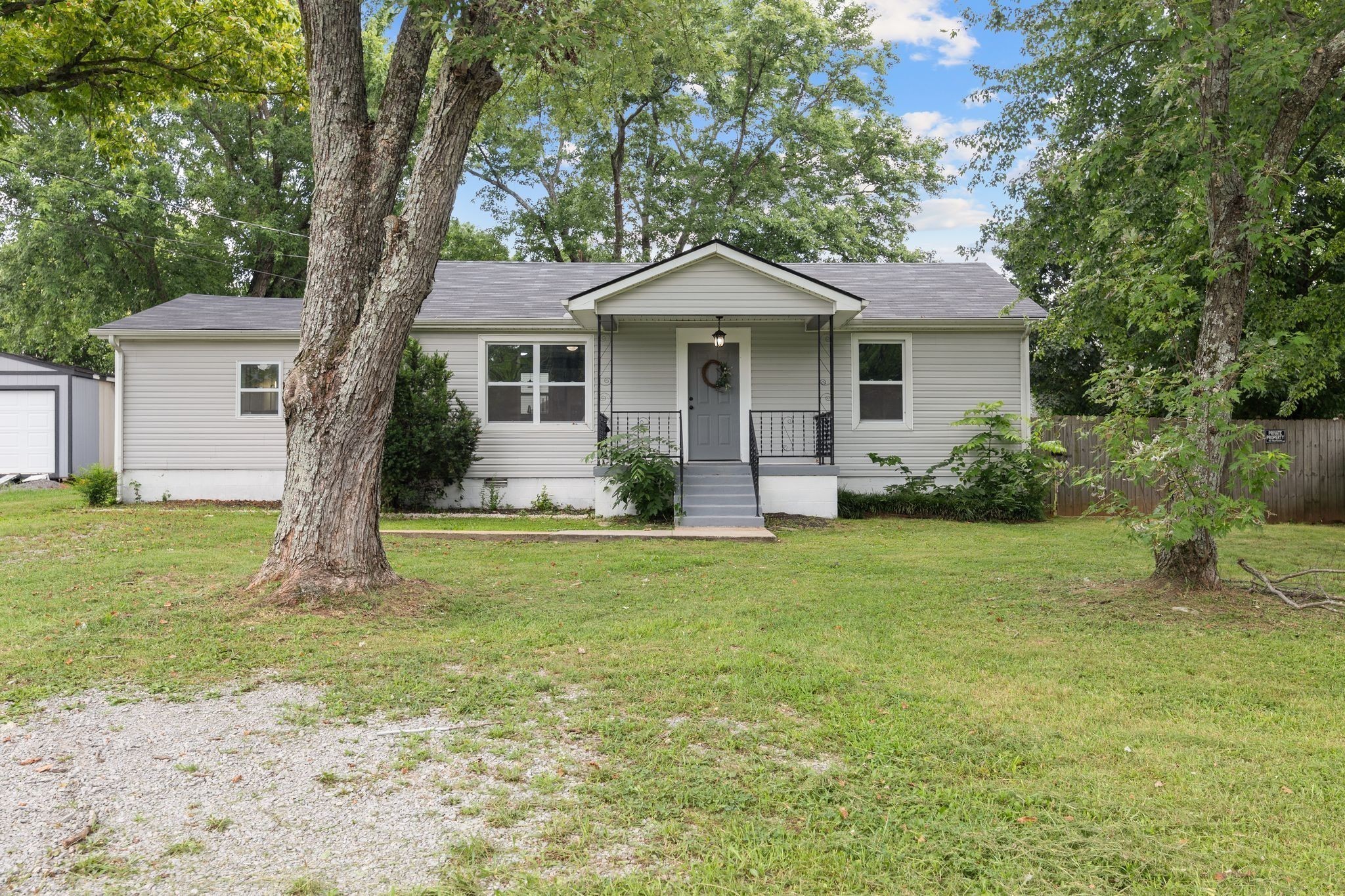 544 Stones River Road La Vergne, TN 37086 - Photo 3 of 27 a front view of a house with garden