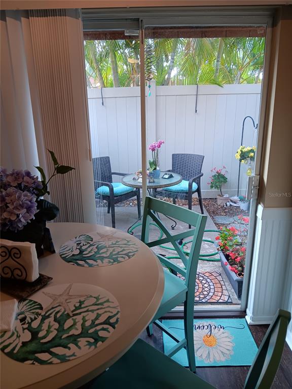 2074 Sunset Point Road, Unit 137 Clearwater, FL 33765 - Photo 3 of 32 a view of a dining room with furniture window and outside view