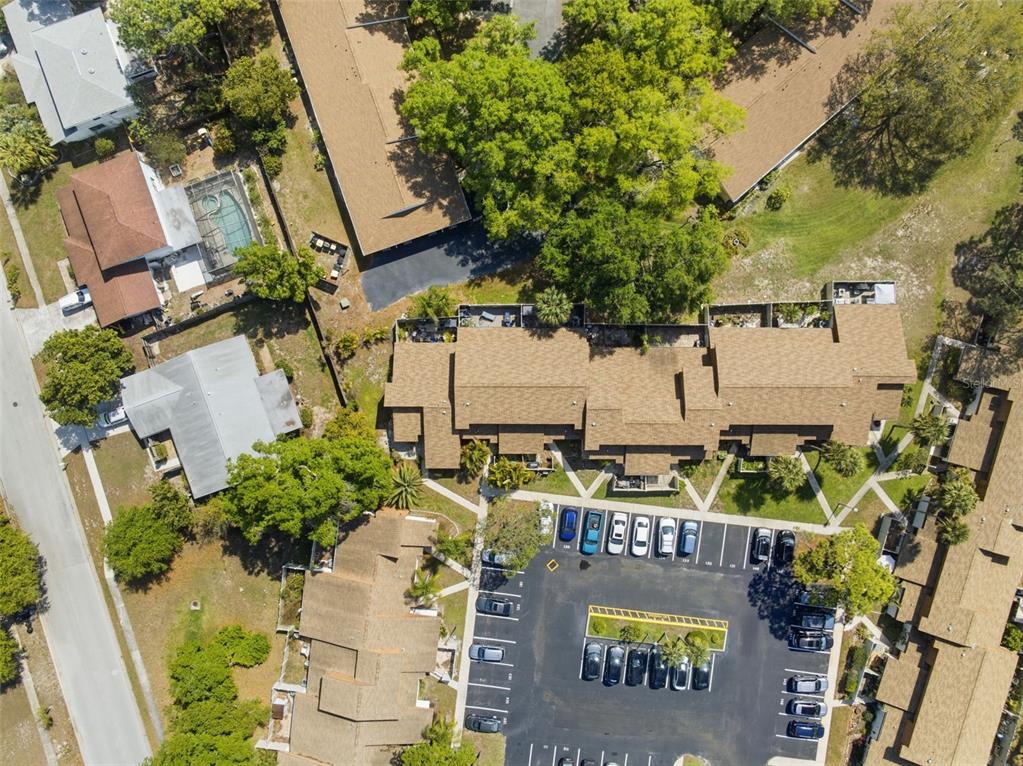 2074 Sunset Point Road, Unit 137 Clearwater, FL 33765 - Photo 31 of 32 an aerial view of multi story residential apartment building with outdoor space