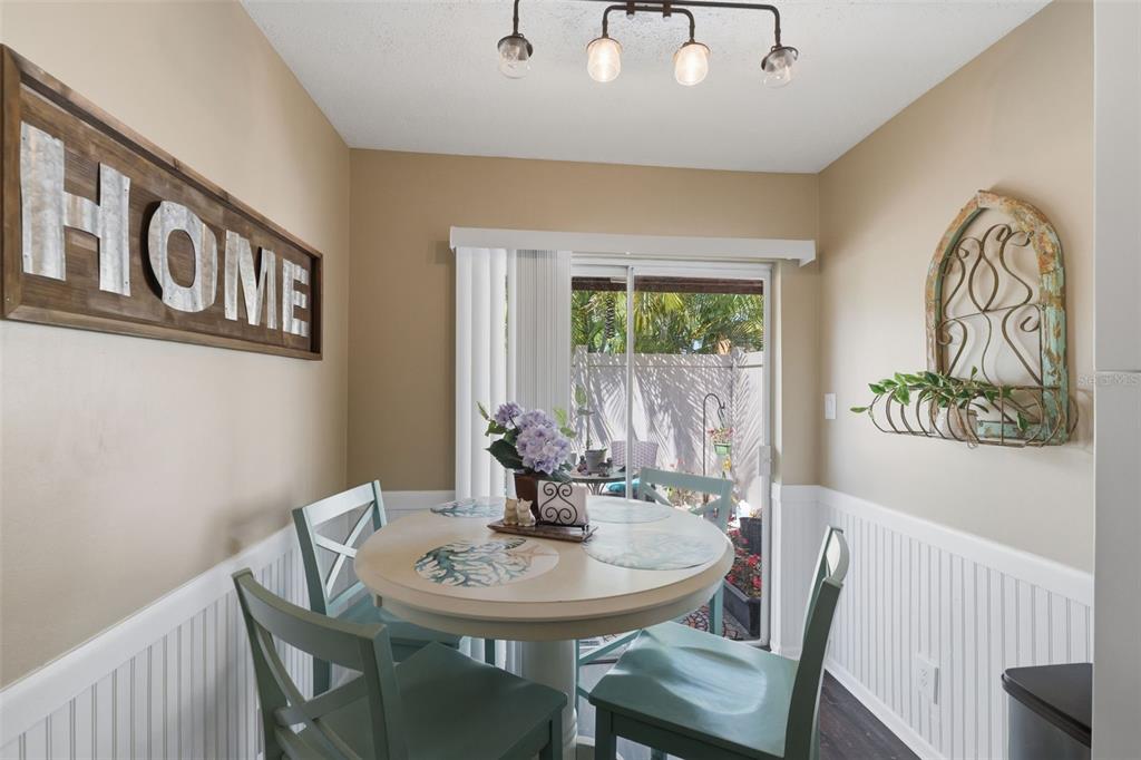 2074 Sunset Point Road, Unit 137 Clearwater, FL 33765 - Photo 5 of 32 a view of a dining room with furniture and a window