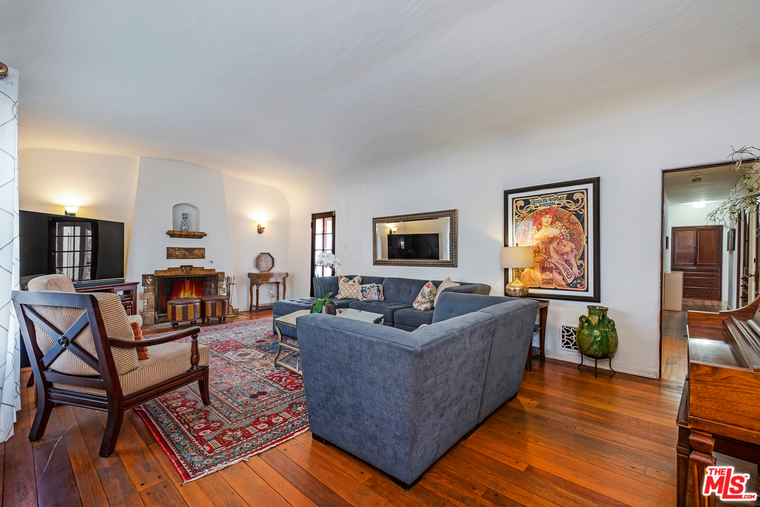 806 Palm Drive Glendale, CA 91202 - Photo 7 of 29 a living room with furniture and a flat screen tv