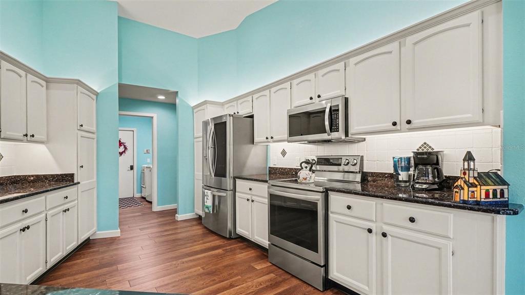 17 Longleaf Court Homosassa, FL 34446 - Photo 12 of 30 a kitchen with stainless steel appliances a stove microwave and refrigerator