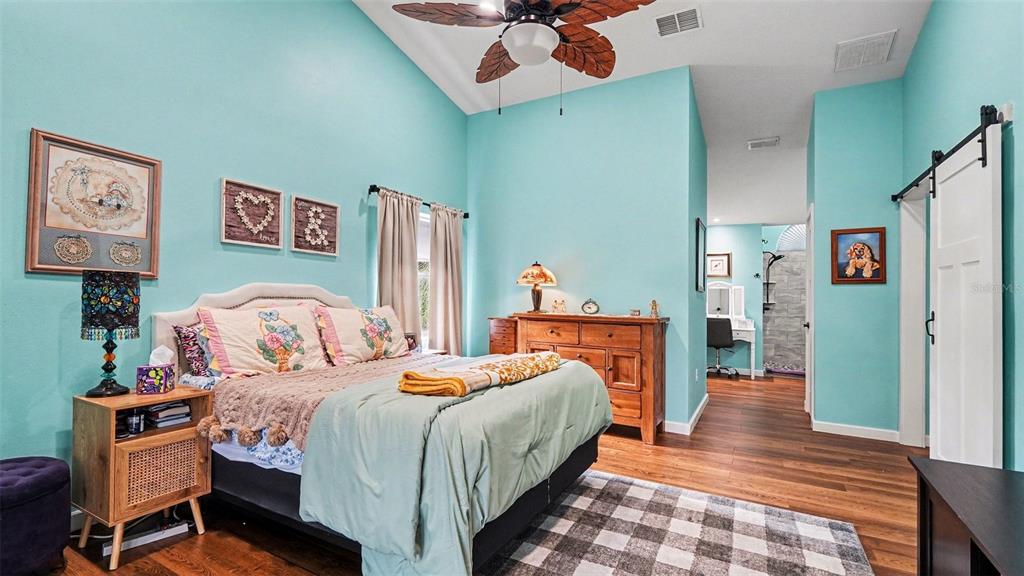 17 Longleaf Court Homosassa, FL 34446 - Photo 17 of 30 a bedroom with a bed and wooden floor