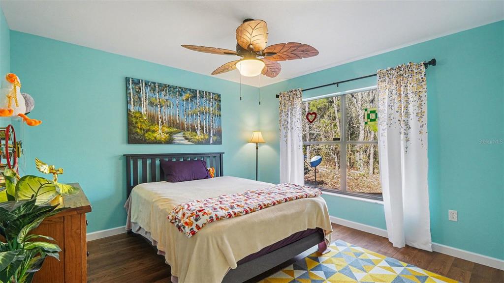 17 Longleaf Court Homosassa, FL 34446 - Photo 20 of 30 a bedroom with a bed and a window