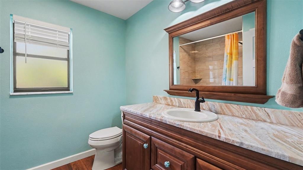 17 Longleaf Court Homosassa, FL 34446 - Photo 23 of 30 a bathroom with a sink a toilet and mirror