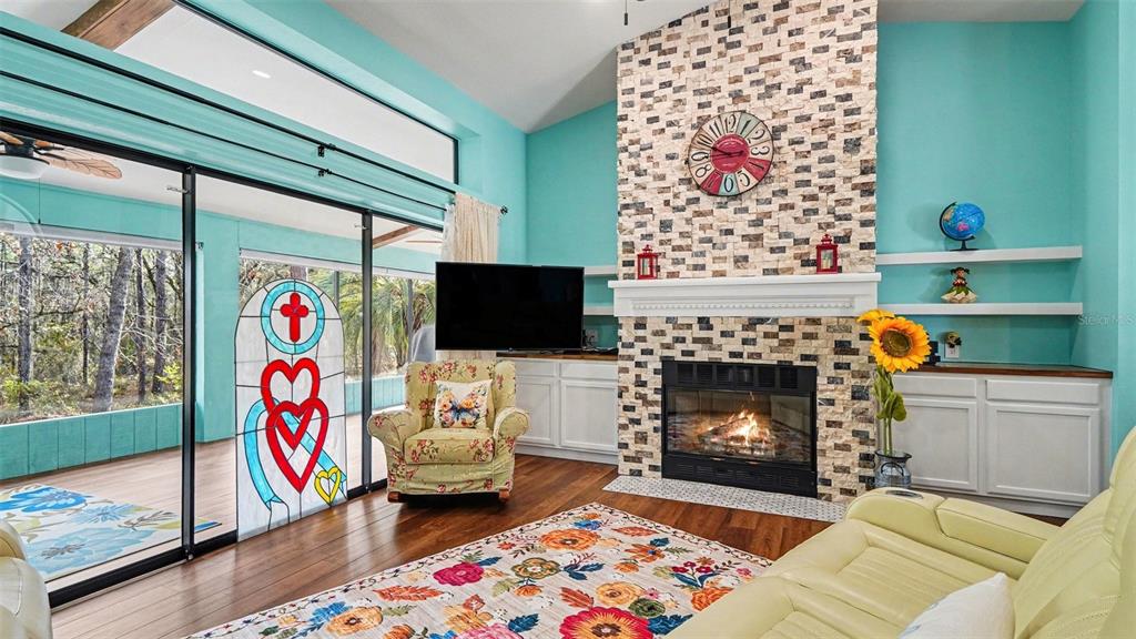 17 Longleaf Court Homosassa, FL 34446 - Photo 5 of 30 a living room with furniture and a fireplace