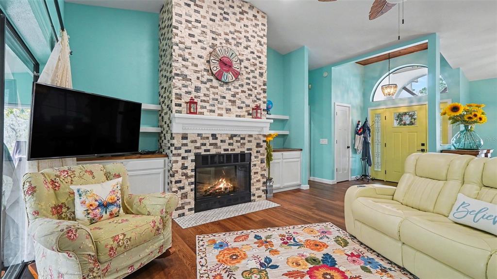 17 Longleaf Court Homosassa, FL 34446 - Photo 6 of 30 a living room with furniture and a fireplace