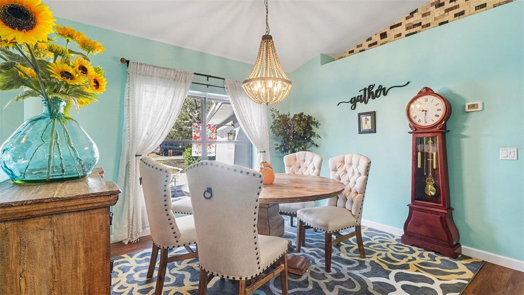 17 Longleaf Court Homosassa, FL 34446 - Photo 8 of 30 a dining room with furniture a rug and a chandelier