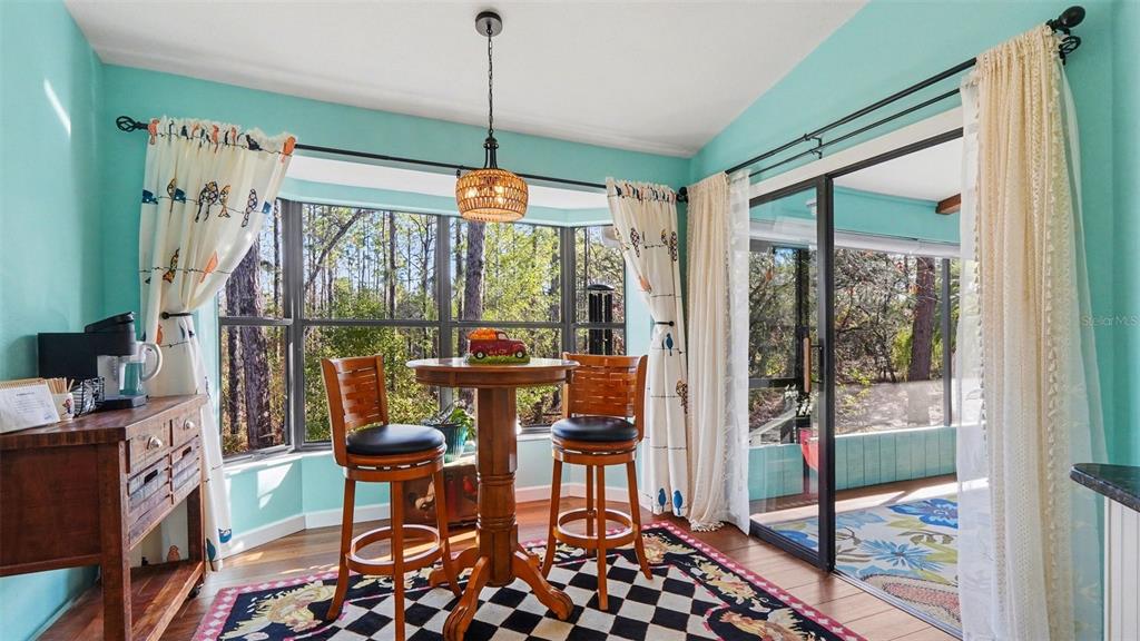 17 Longleaf Court Homosassa, FL 34446 - Photo 10 of 30 a view of a dining room with furniture window and outside view
