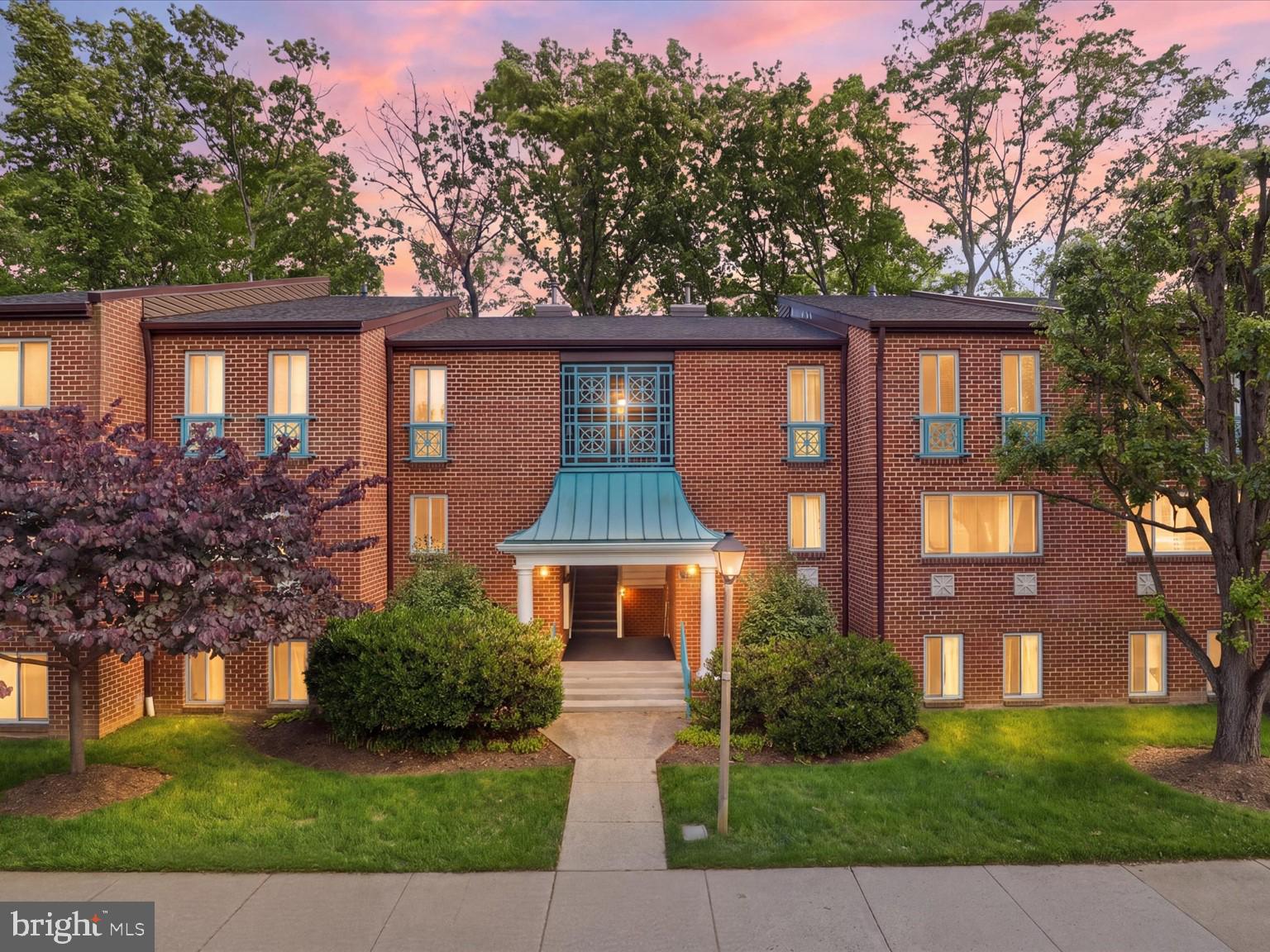 11809 Breton Court, Unit 2B Reston, VA 20191 - Photo 3 of 29 a front view of a house with garden