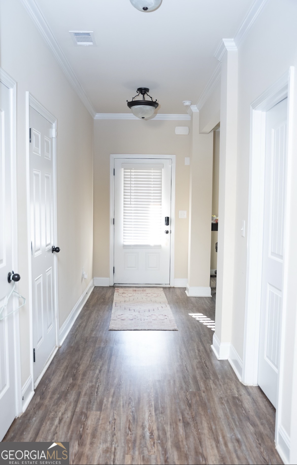6014 Prodigy Lane Locust Grove, GA 30248 - Photo 5 of 7 wooden floor in an empty room with a window