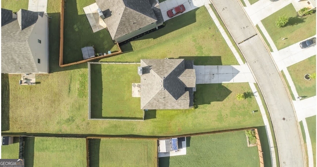 6014 Prodigy Lane Locust Grove, GA 30248 - Photo 7 of 7 an aerial view of a house with swimming pool