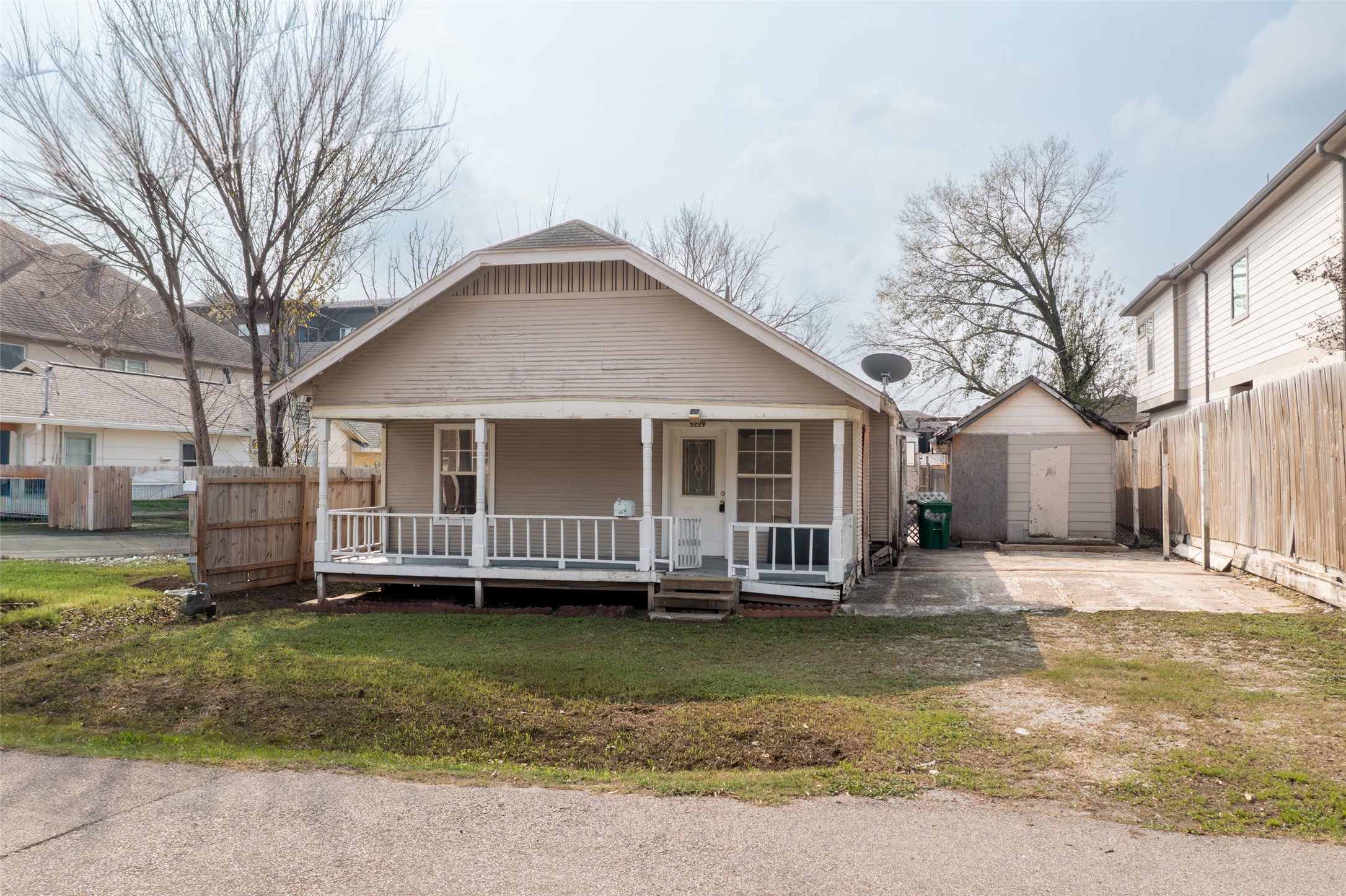 5229 Eigel Street Houston, TX 77007 - Photo 2 of 19 a view of a house with a yard and large trees