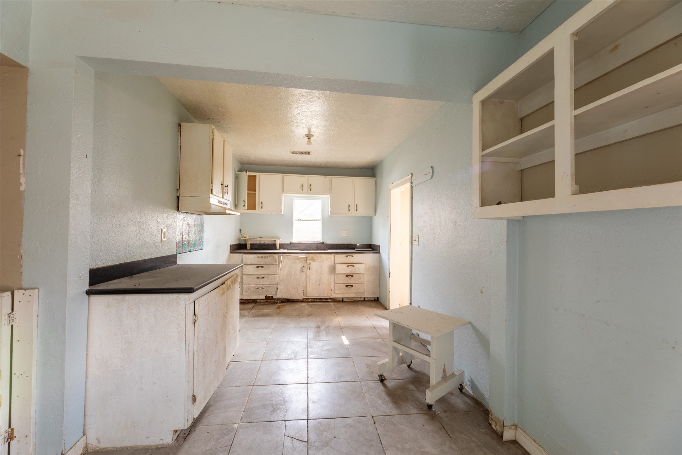 5229 Eigel Street Houston, TX 77007 - Photo 7 of 19 a kitchen with a cabinets and window