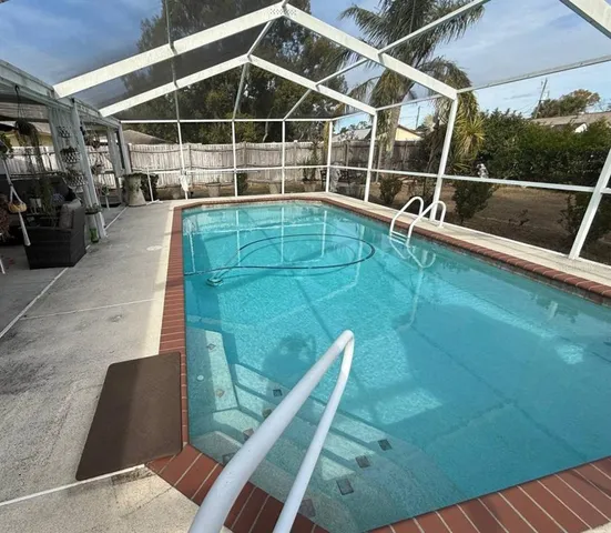 a view of a swimming pool with a chair