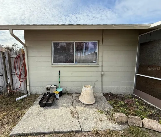 a view of a backyard of the house