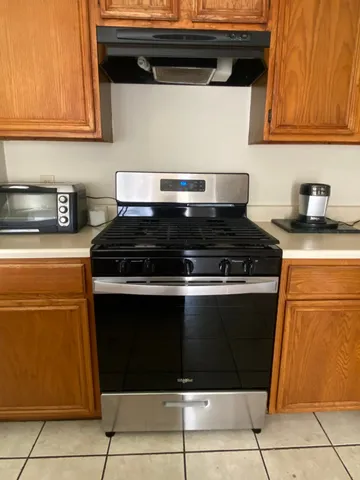 an empty room with a empty space and windows