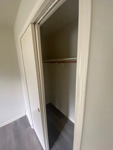 a bathroom with a tub a sink a mirror and a shower