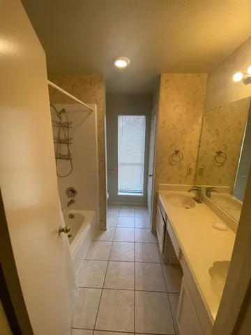 a view of a house with backyard porch and sitting area