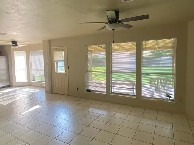 a kitchen with a refrigerator and a sink