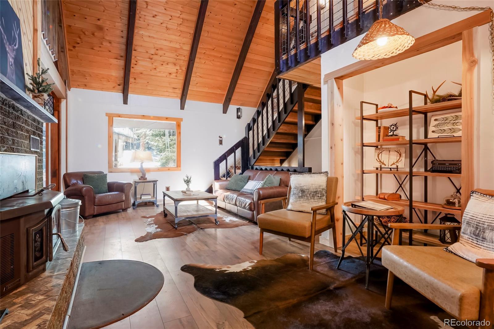 3237 Mill Creek Road Dumont, CO 80436 - Photo 12 of 48 a living room with furniture or couch and a flat screen tv