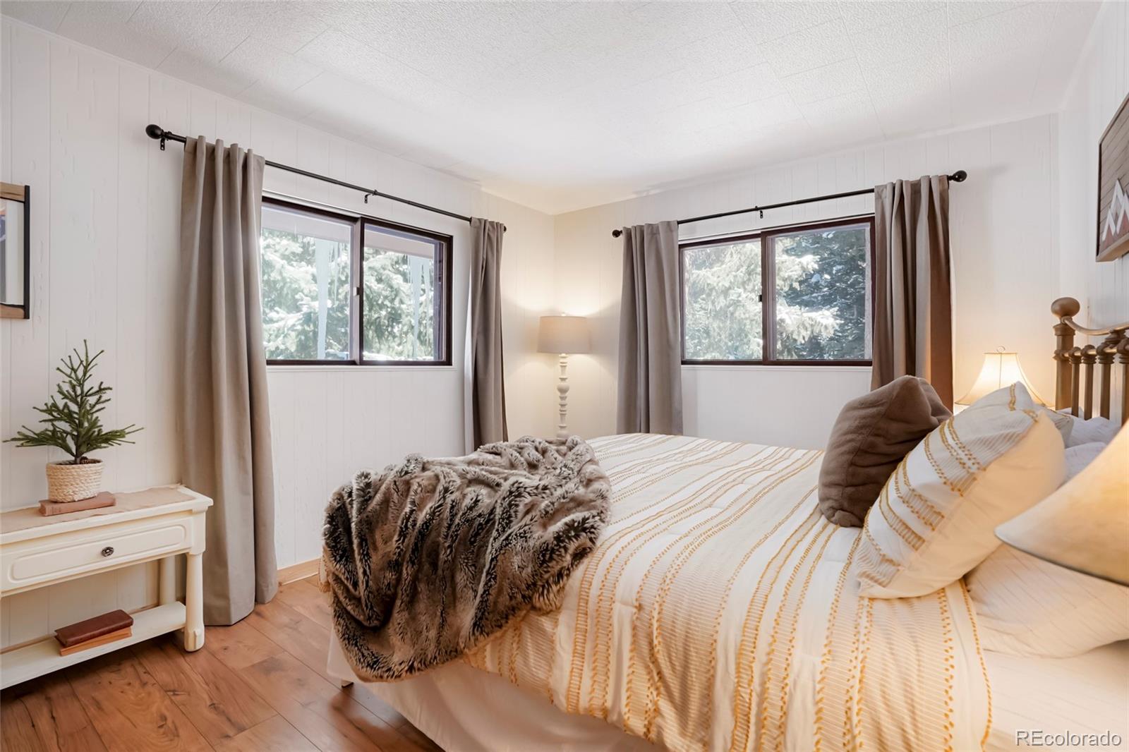 3237 Mill Creek Road Dumont, CO 80436 - Photo 22 of 48 a bedroom with a bed and a window