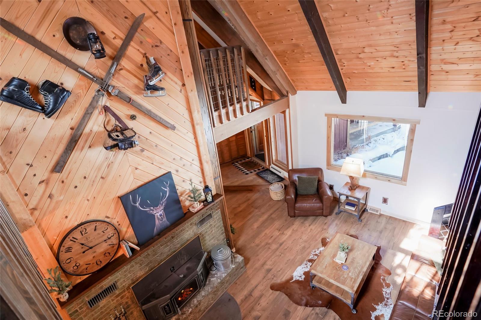 3237 Mill Creek Road Dumont, CO 80436 - Photo 26 of 48 a living room with furniture and a fireplace
