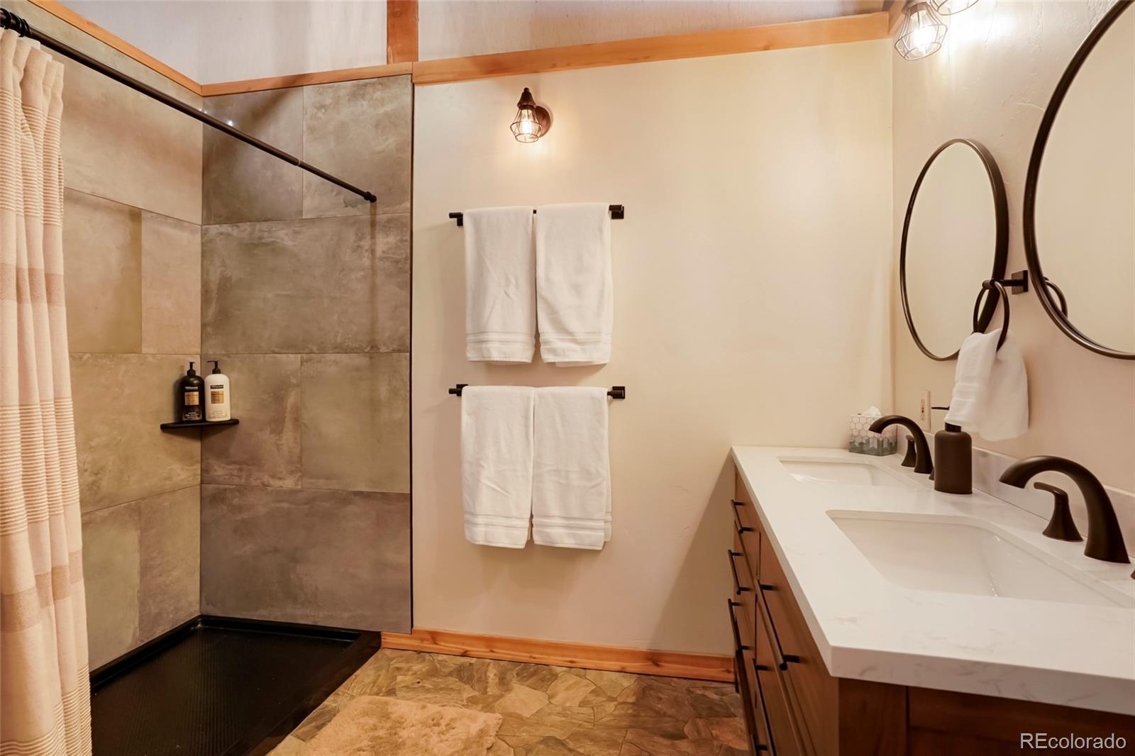 3237 Mill Creek Road Dumont, CO 80436 - Photo 31 of 48 a bathroom with a sink and a shower