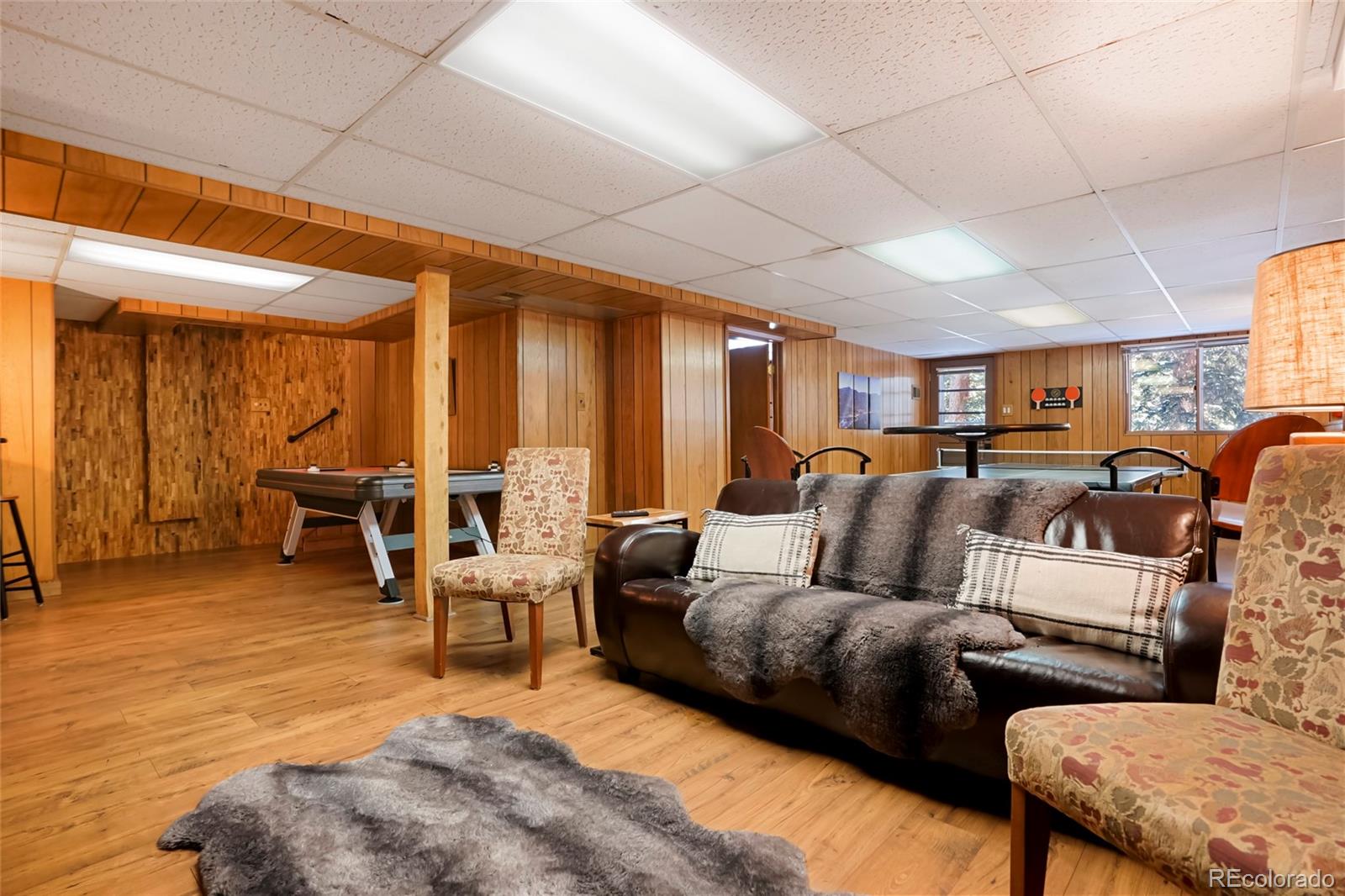 3237 Mill Creek Road Dumont, CO 80436 - Photo 34 of 48 a living room with furniture and wooden floors