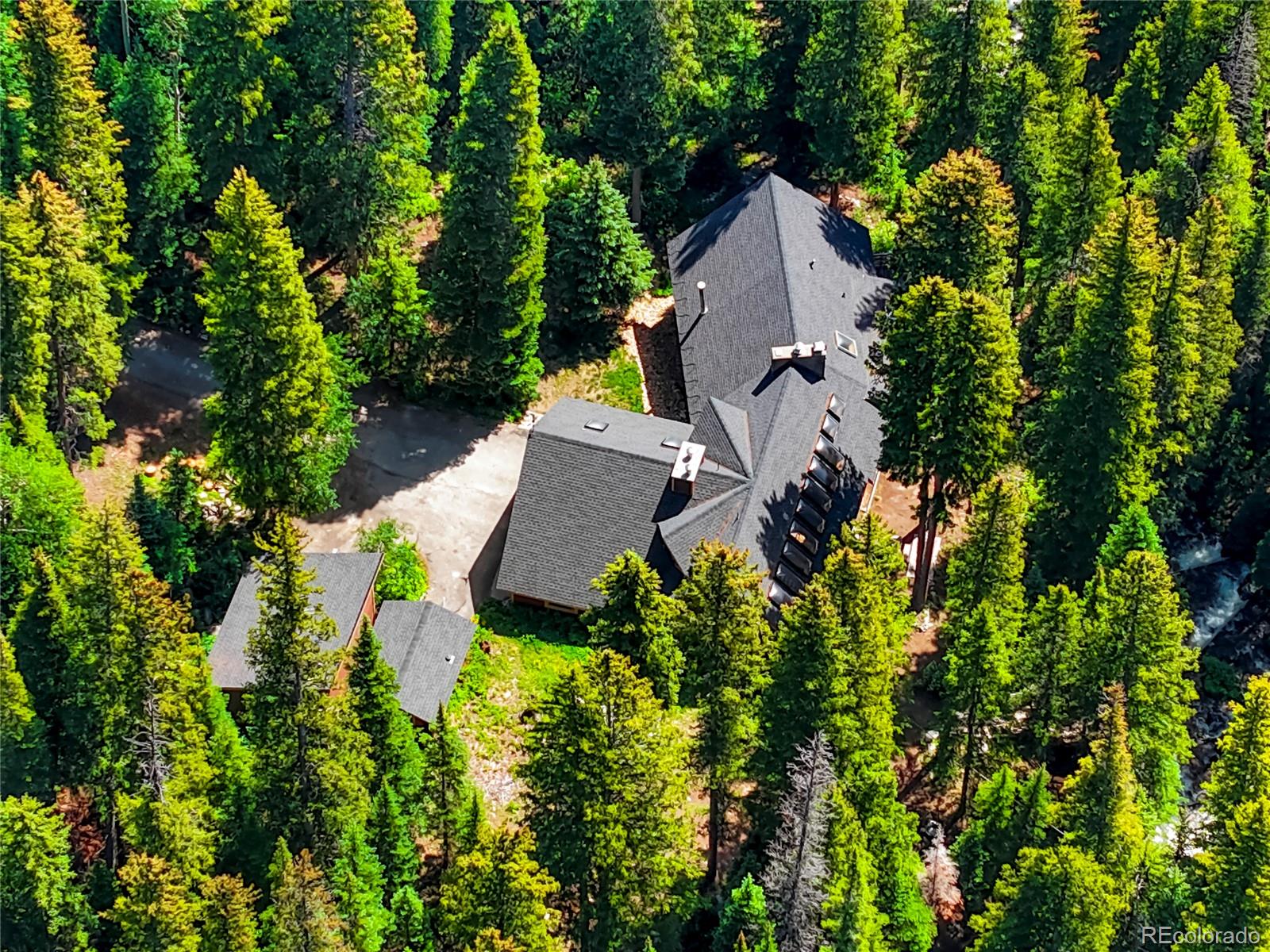3237 Mill Creek Road Dumont, CO 80436 - Photo 46 of 48 an aerial view of a house with a yard and garden
