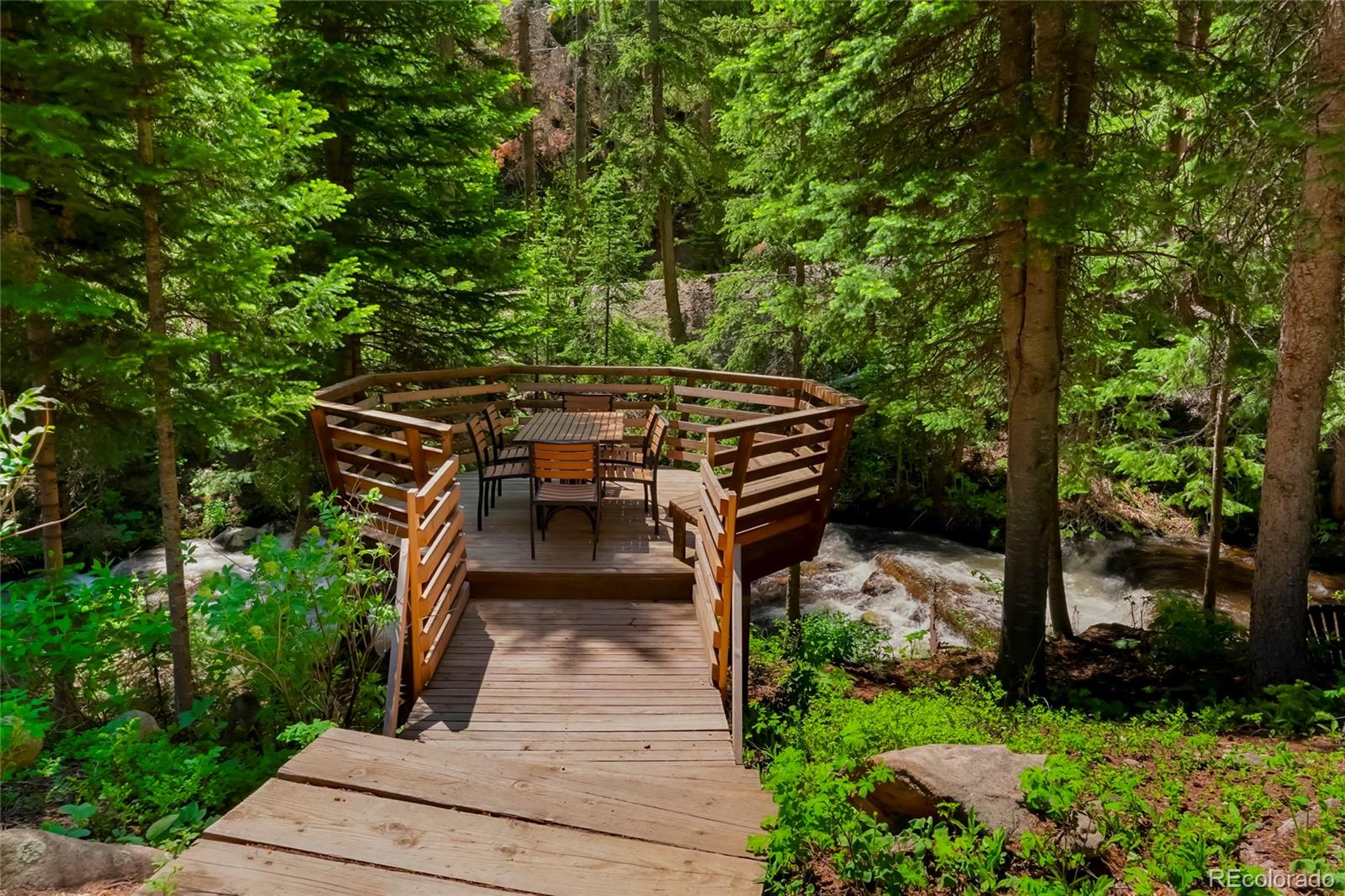 3237 Mill Creek Road Dumont, CO 80436 - Photo 47 of 48 a view of a patio with chairs and potted plants