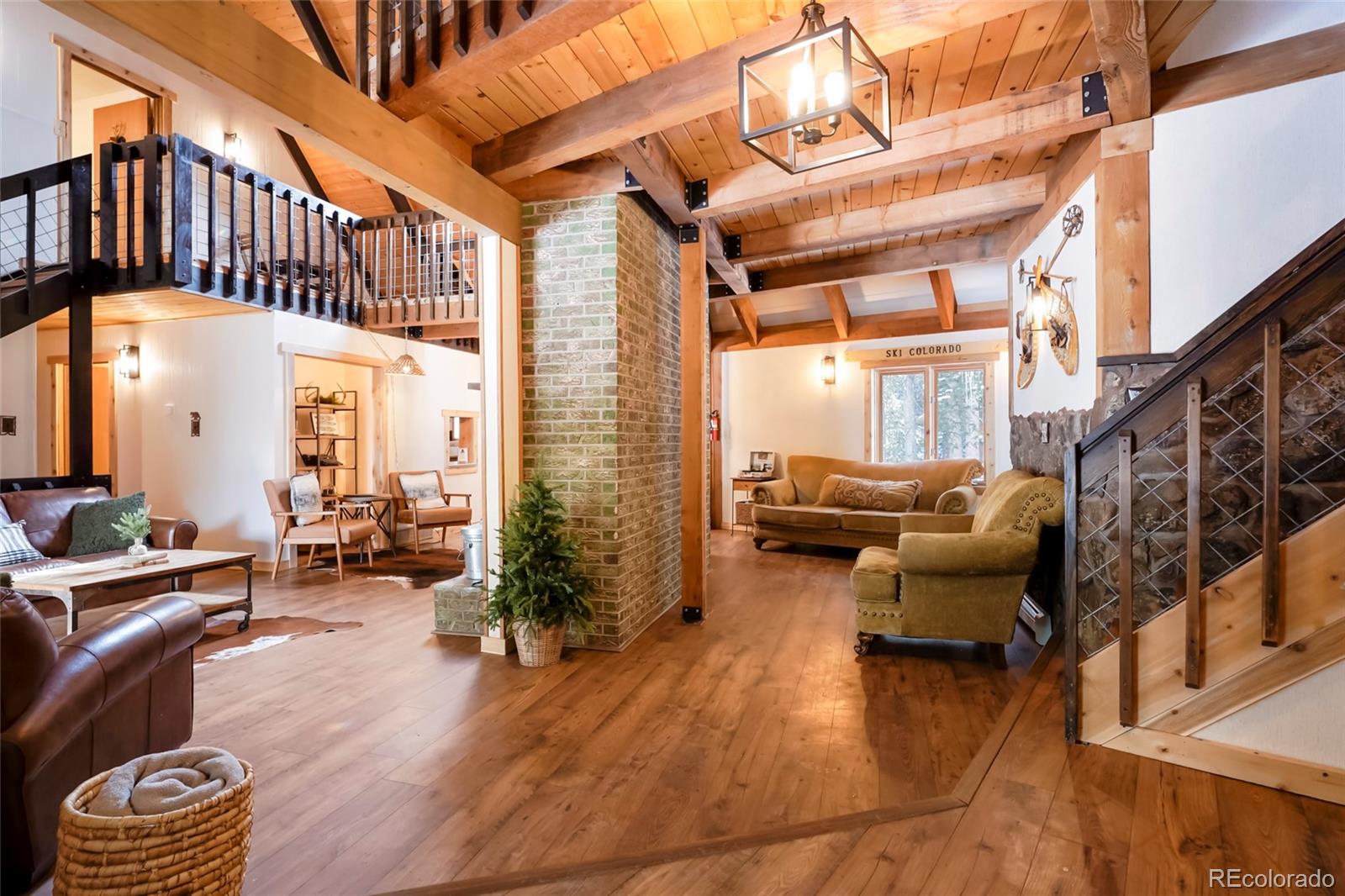 3237 Mill Creek Road Dumont, CO 80436 - Photo 6 of 48 a balcony with furniture and staircase