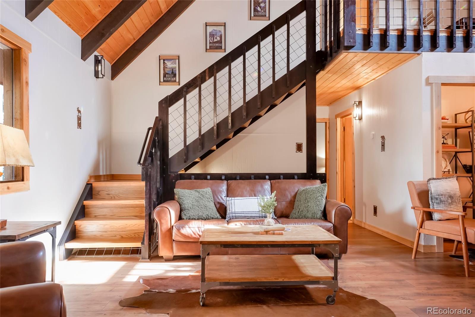 3237 Mill Creek Road Dumont, CO 80436 - Photo 9 of 48 a view of entryway livingroom and hall with wooden floor