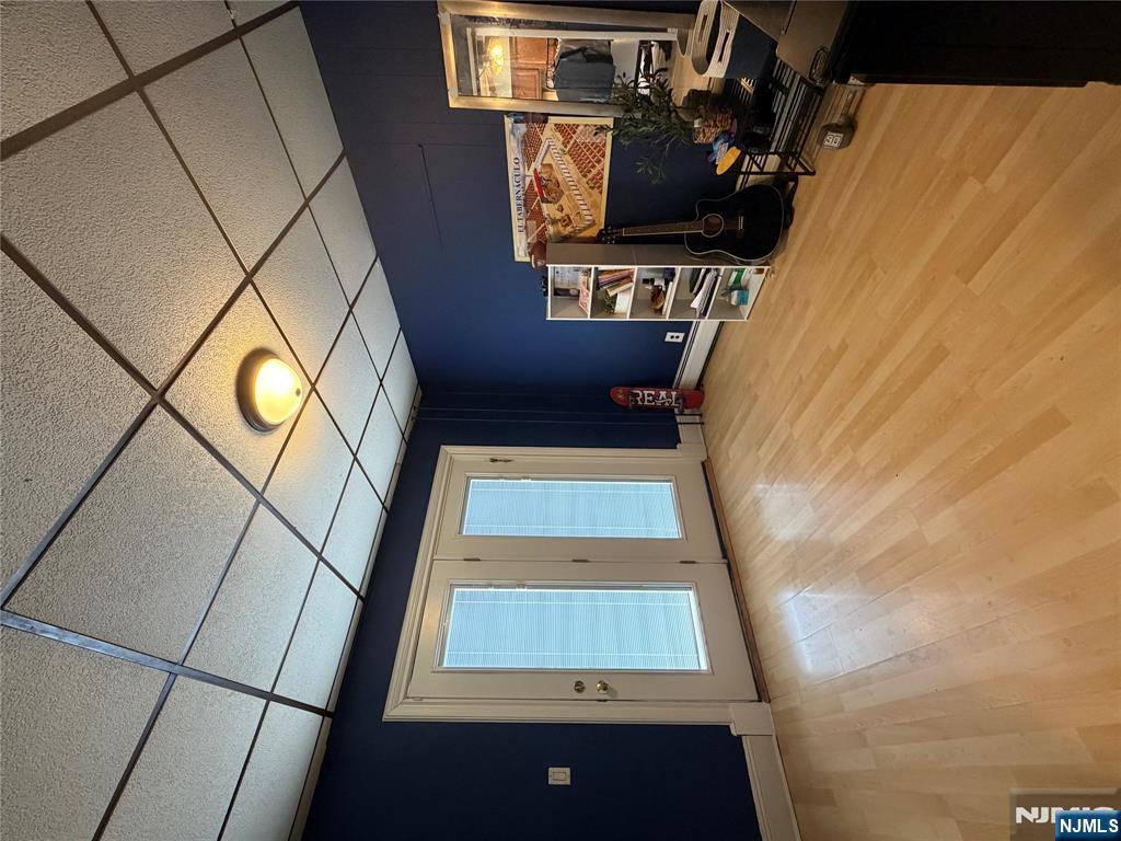 373 McKinley Street Fairview, NJ 07022 - Photo 3 of 8 a view of room with furniture and a flat screen tv