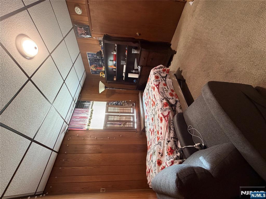 373 McKinley Street Fairview, NJ 07022 - Photo 7 of 8 a bedroom with bed and window