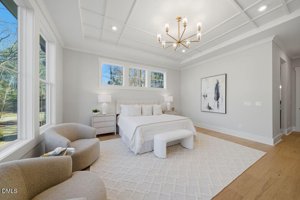 8729 Allison Road Cedar Grove, NC 27231 - Photo 23 of 63 a spacious bedroom with a bed and a couch