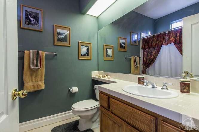 11226 Bentcreek Road Moorpark, CA 93021 - Photo 22 of 41 a bathroom with a sink toilet and shower