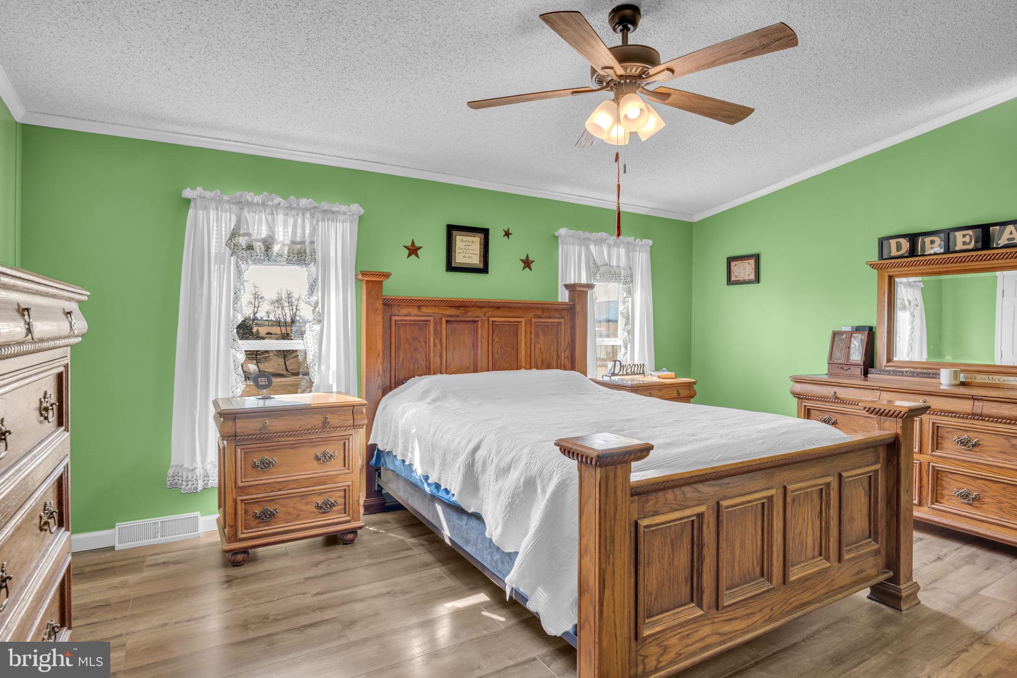 21 Butler Lane Newville, PA 17241 - Photo 14 of 56 a bedroom with a bed and a chandelier