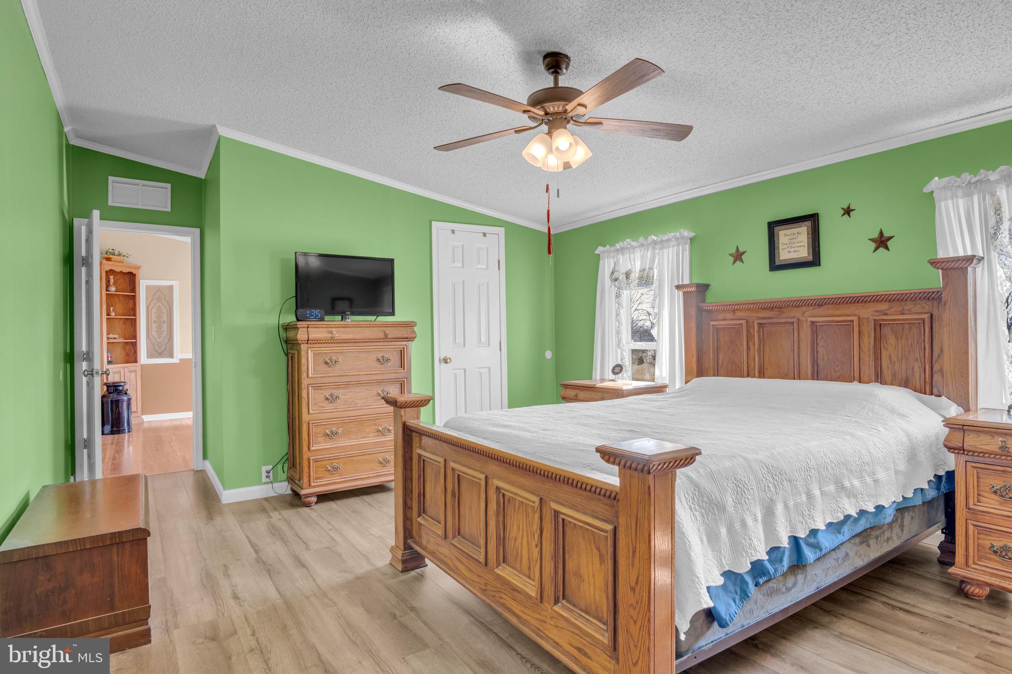 21 Butler Lane Newville, PA 17241 - Photo 15 of 56 a bedroom with a bed and a flat screen tv