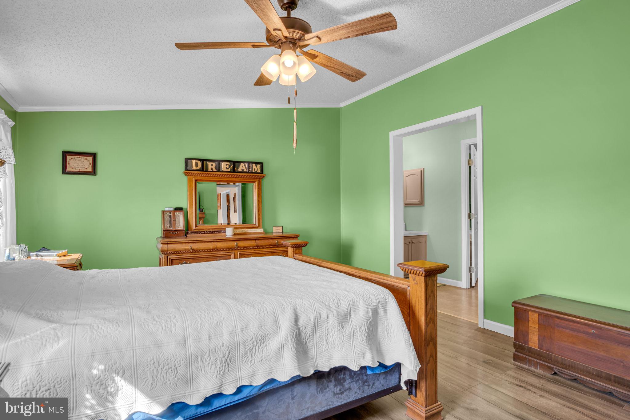 21 Butler Lane Newville, PA 17241 - Photo 16 of 56 a bedroom with a bed and a chandelier
