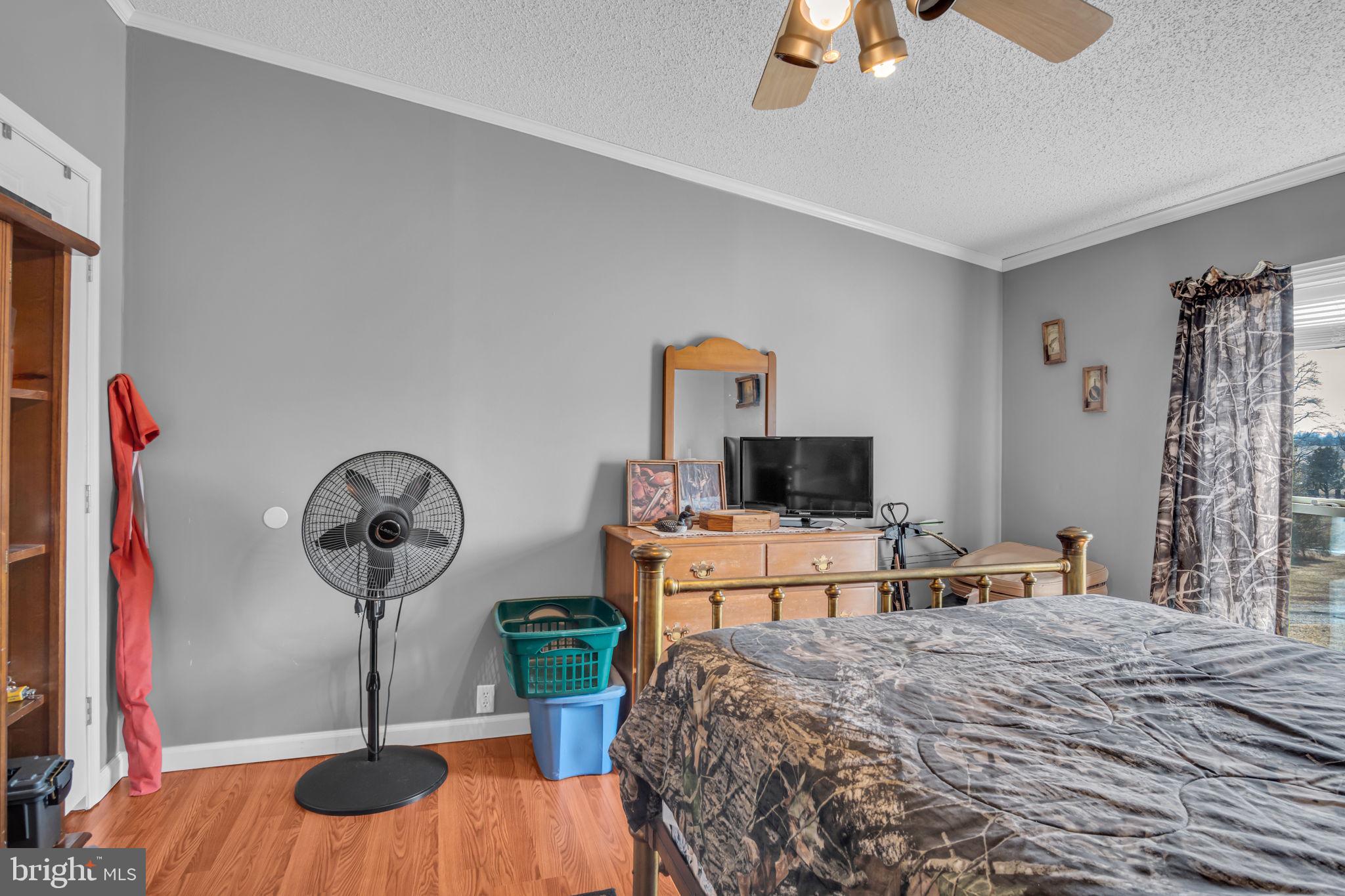 21 Butler Lane Newville, PA 17241 - Photo 21 of 56 a bedroom with a bed and a chandelier
