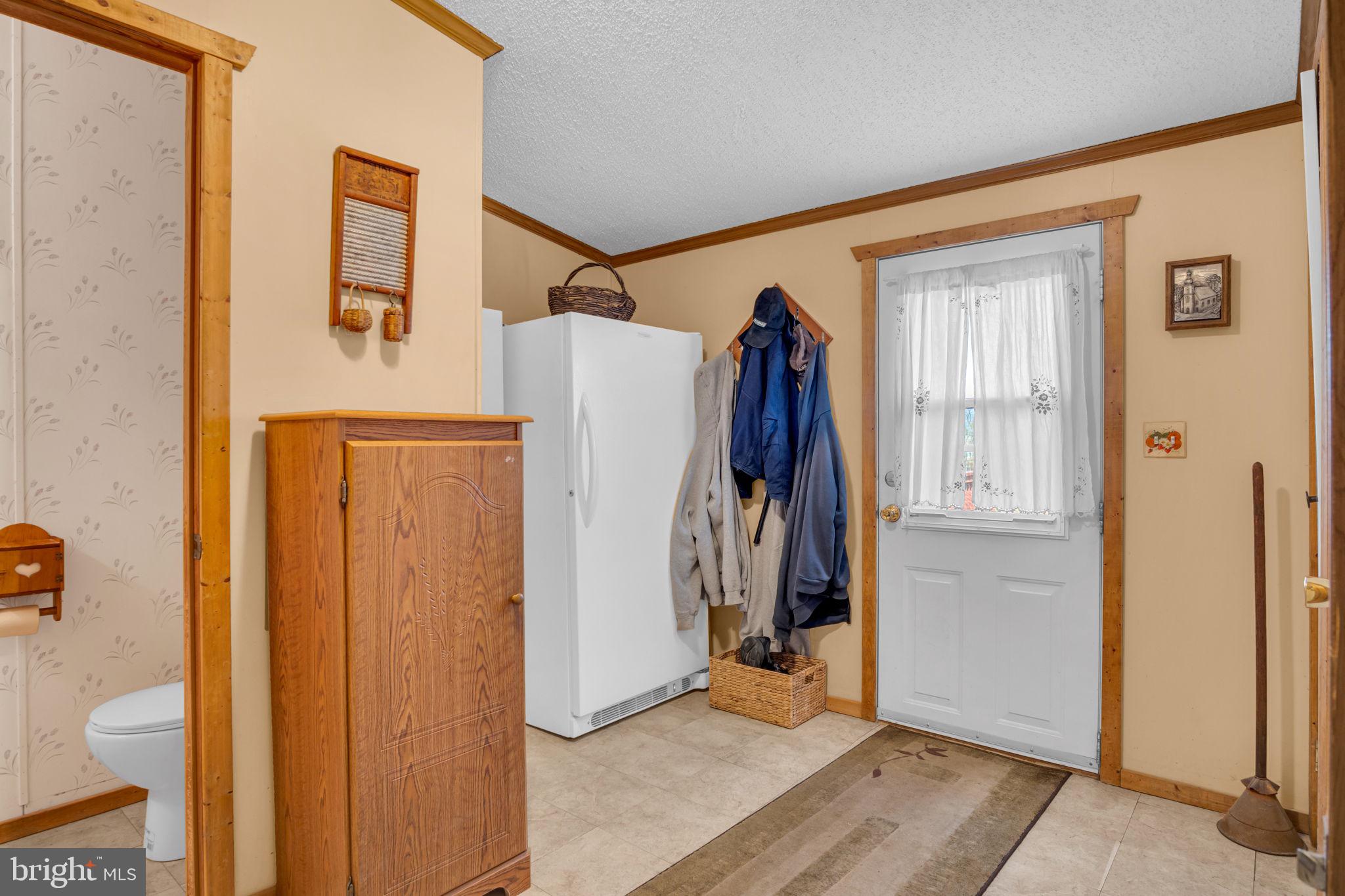 21 Butler Lane Newville, PA 17241 - Photo 27 of 56 a view of a hallway with wooden walls and stairs