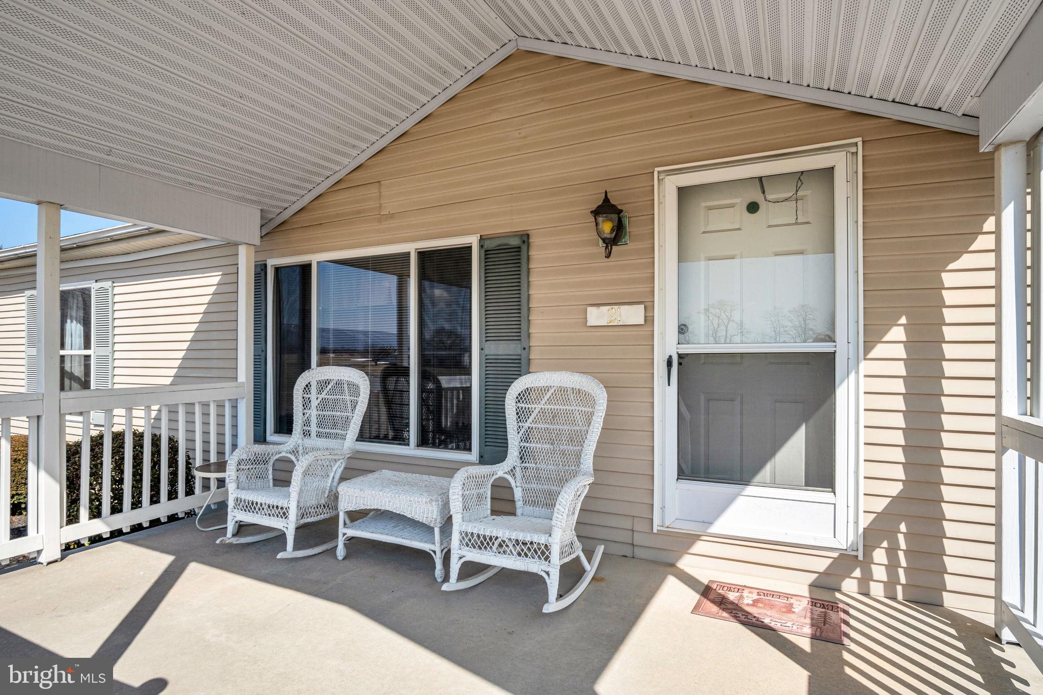 21 Butler Lane Newville, PA 17241 - Photo 3 of 56 a balcony with chairs and a potted plant