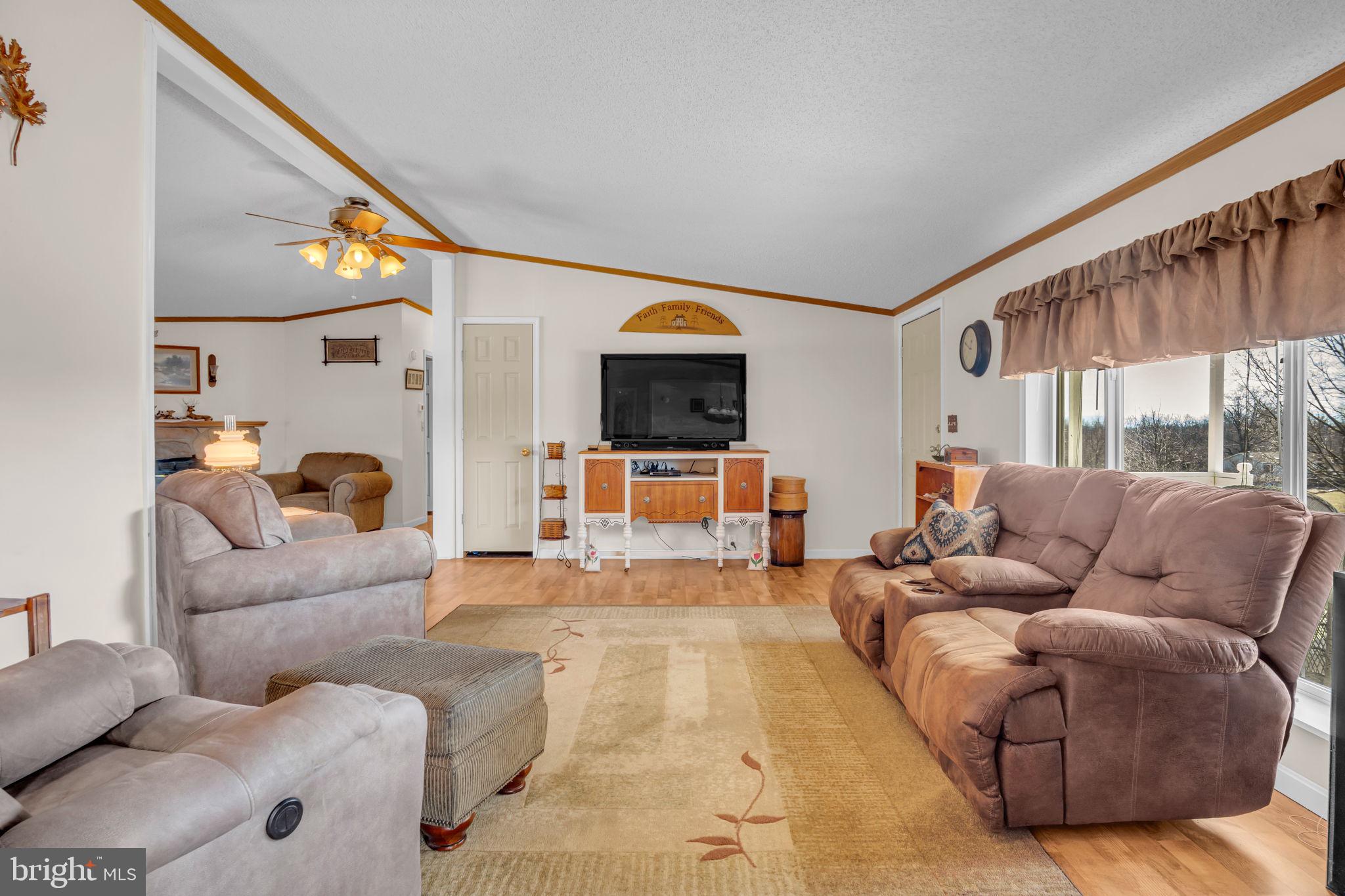 21 Butler Lane Newville, PA 17241 - Photo 6 of 56 a living room with furniture and a flat screen tv