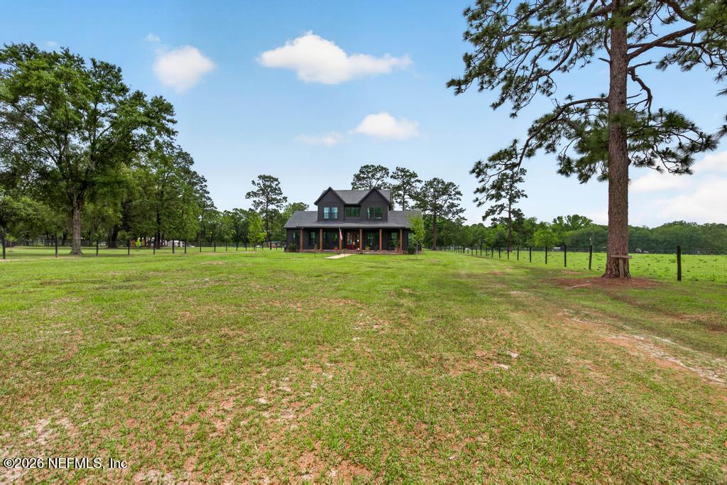 2955 Carroll Corner Road Hilliard, FL 32046 - Photo 9 of 106 a view of a golf course with a tree