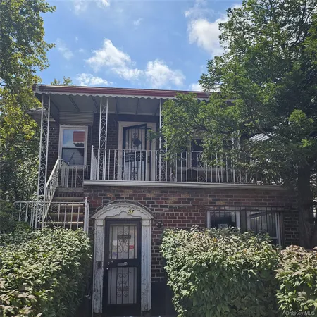front view of a house with a small yard