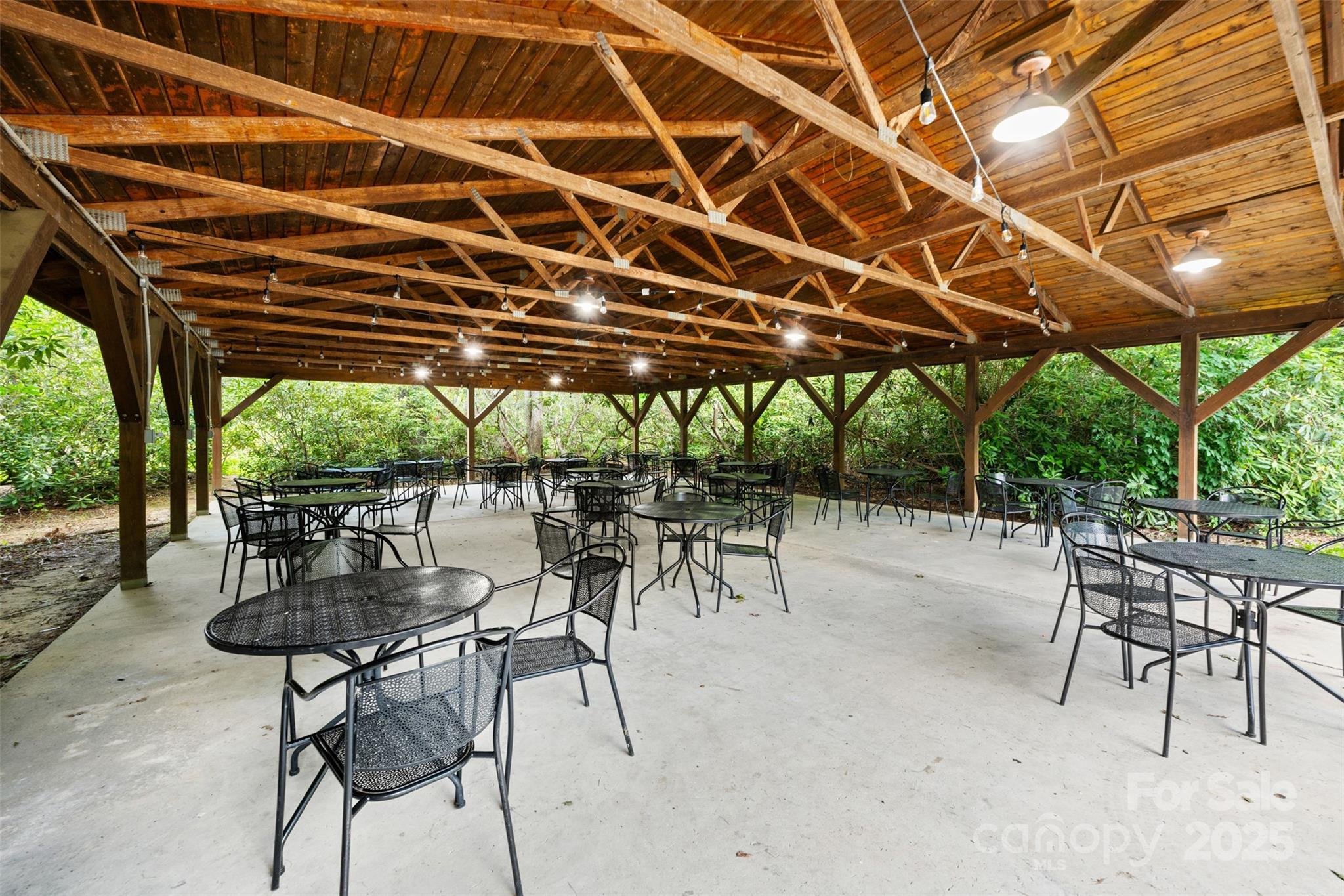 140 Pine View Road, Unit 43 Newland, NC 28657 - Photo 26 of 29 a patio with a table and chairs and a barbeque
